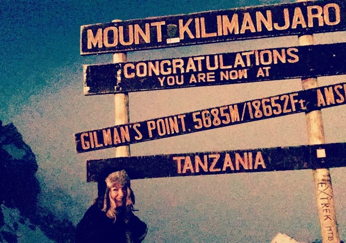 Wendy B on the summit of Mt. Kilimanjaro